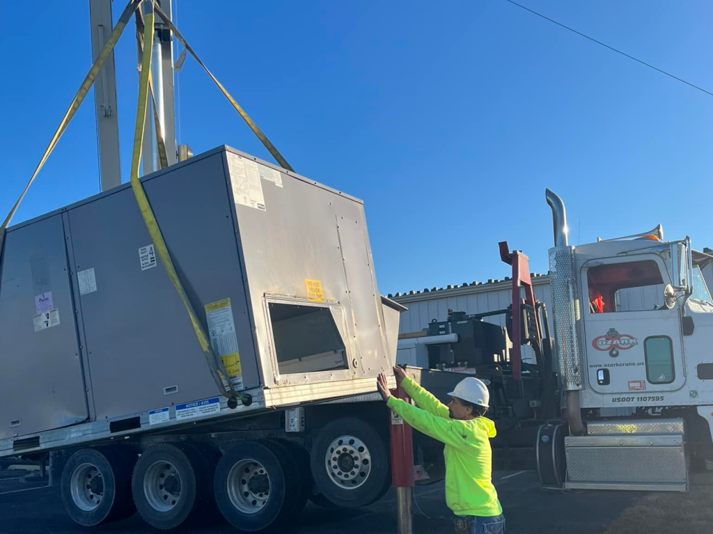 Cranes lifting HVAC units