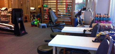 White Rock Orthopaedic & Sports Physiotherapy Clinic interior tables and exercise equipment
