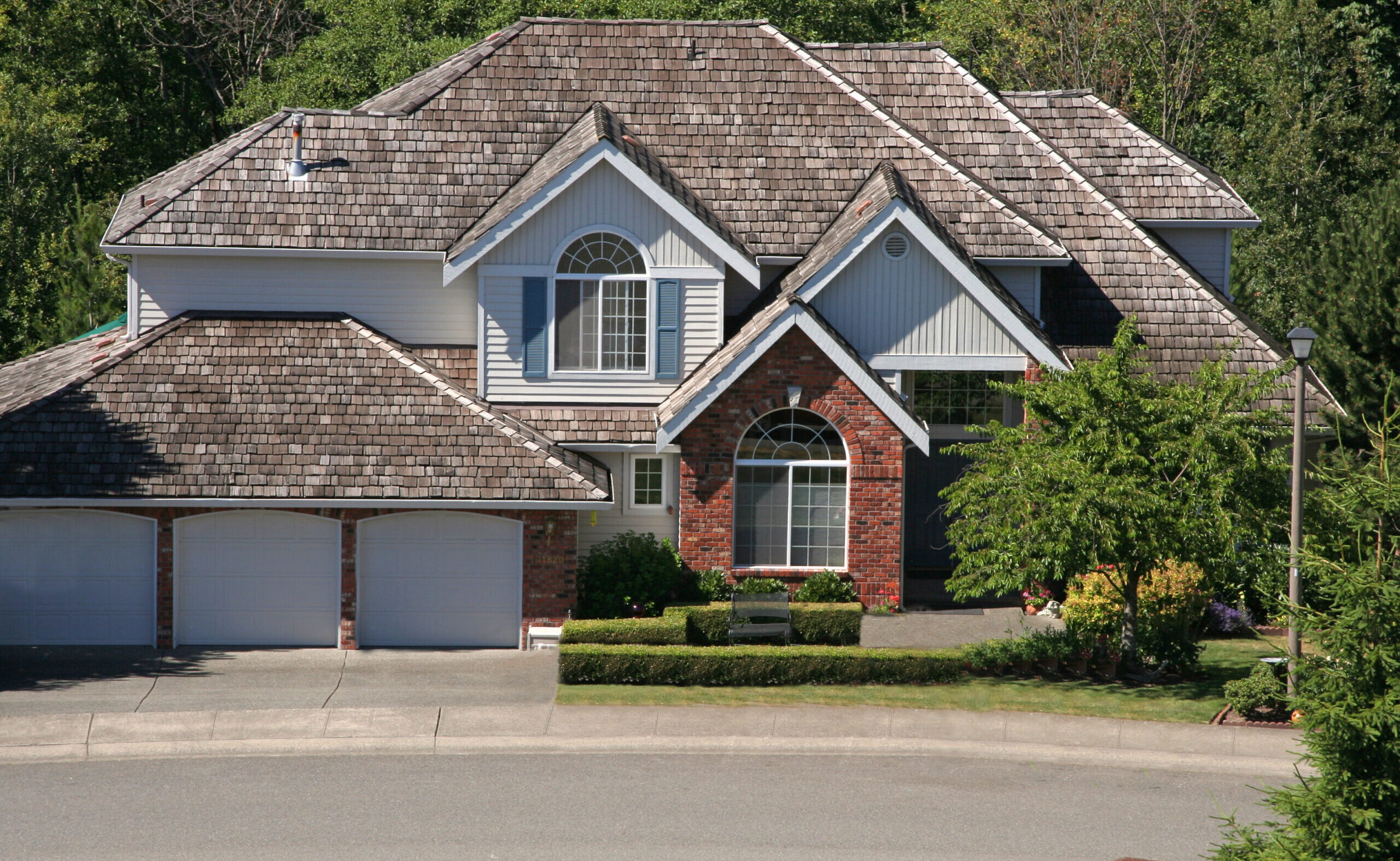 Roofer installing a new roof on a house