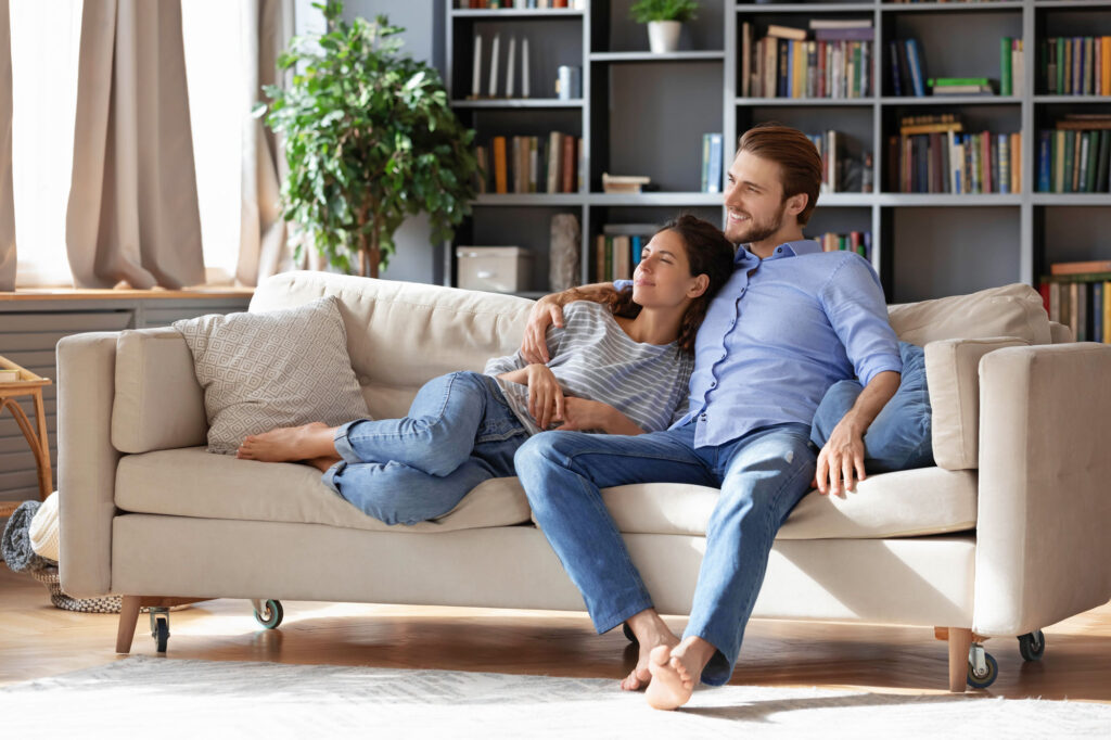 Renters resting on a couch