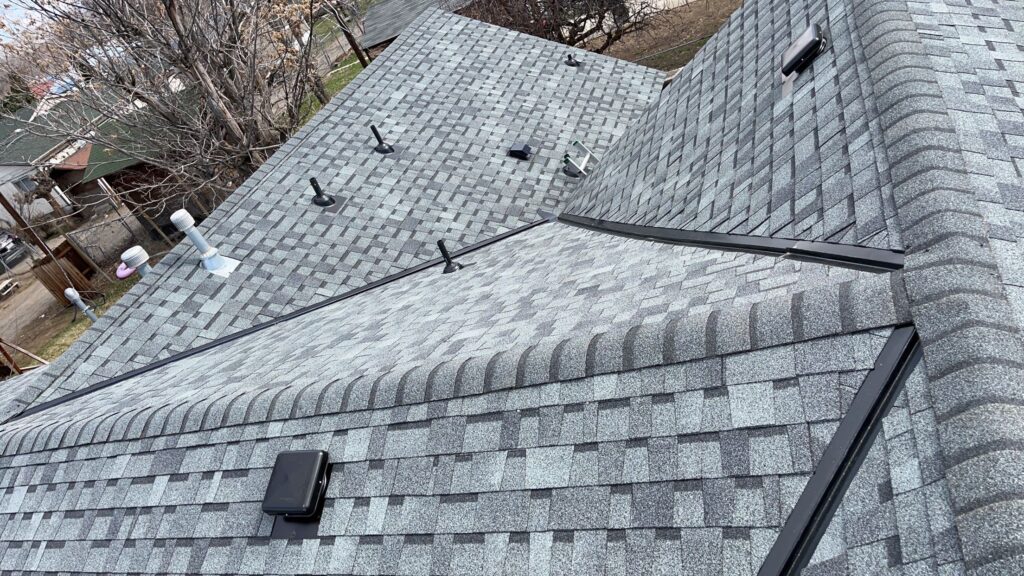 Top view of a gray asphalt shingle roof