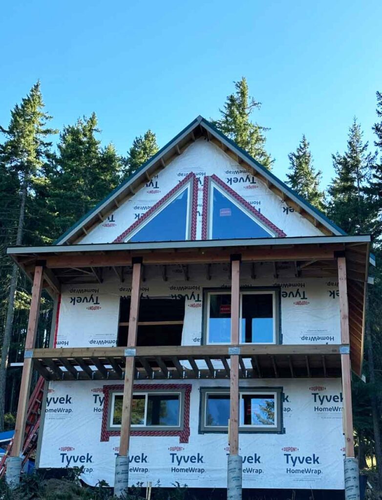 A+ Quality Construction exterior framing with Tyvek HomeWrap and roof sheathing in progress