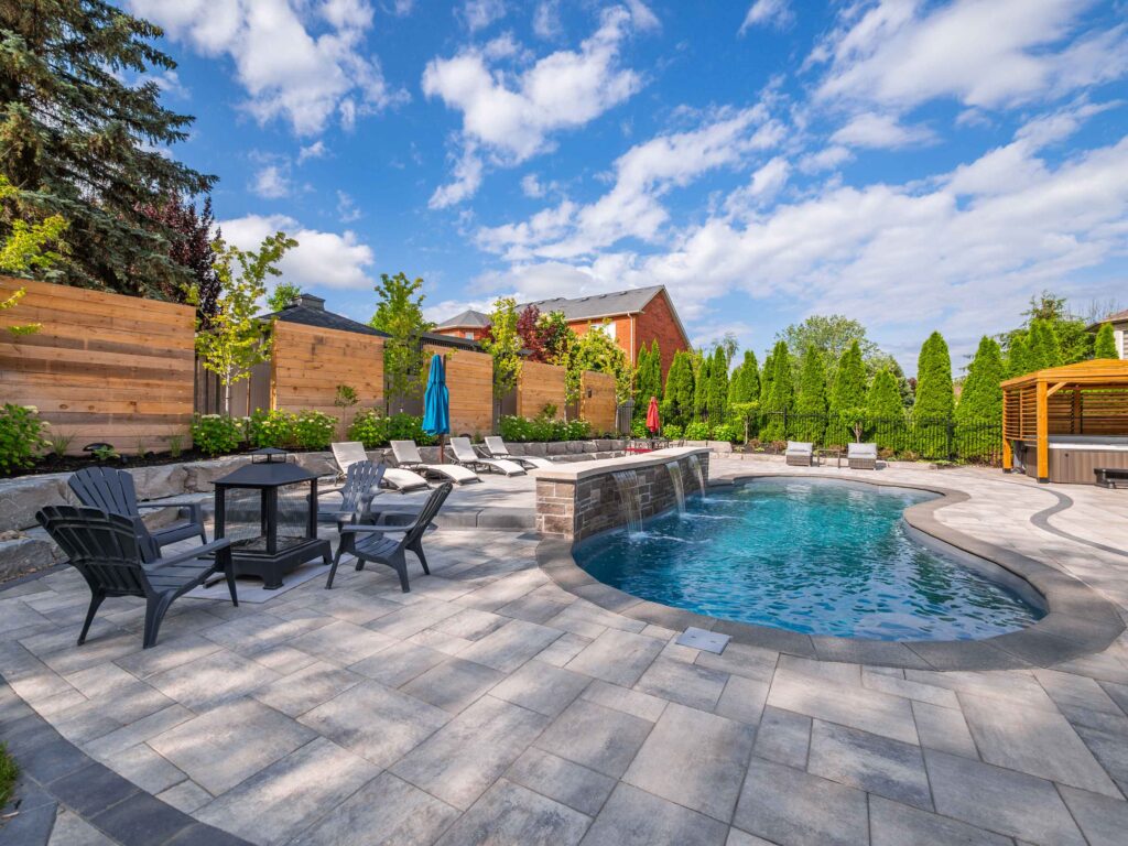 Interlocking stone patio around pool