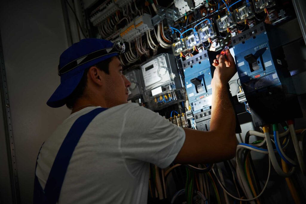 Photo of electrician working on repairs in emergency service