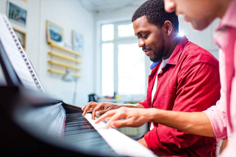 Stephanie's Musique music lesson with a tutor playing the piano