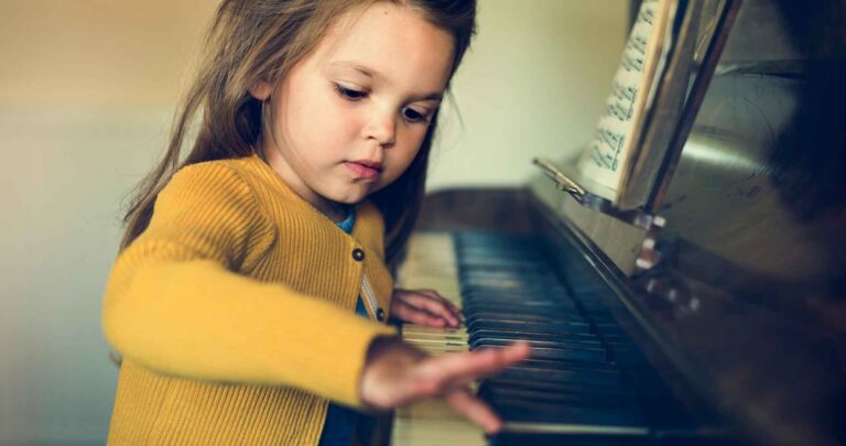 Young woman playing piano, representing Stephanie's Musique