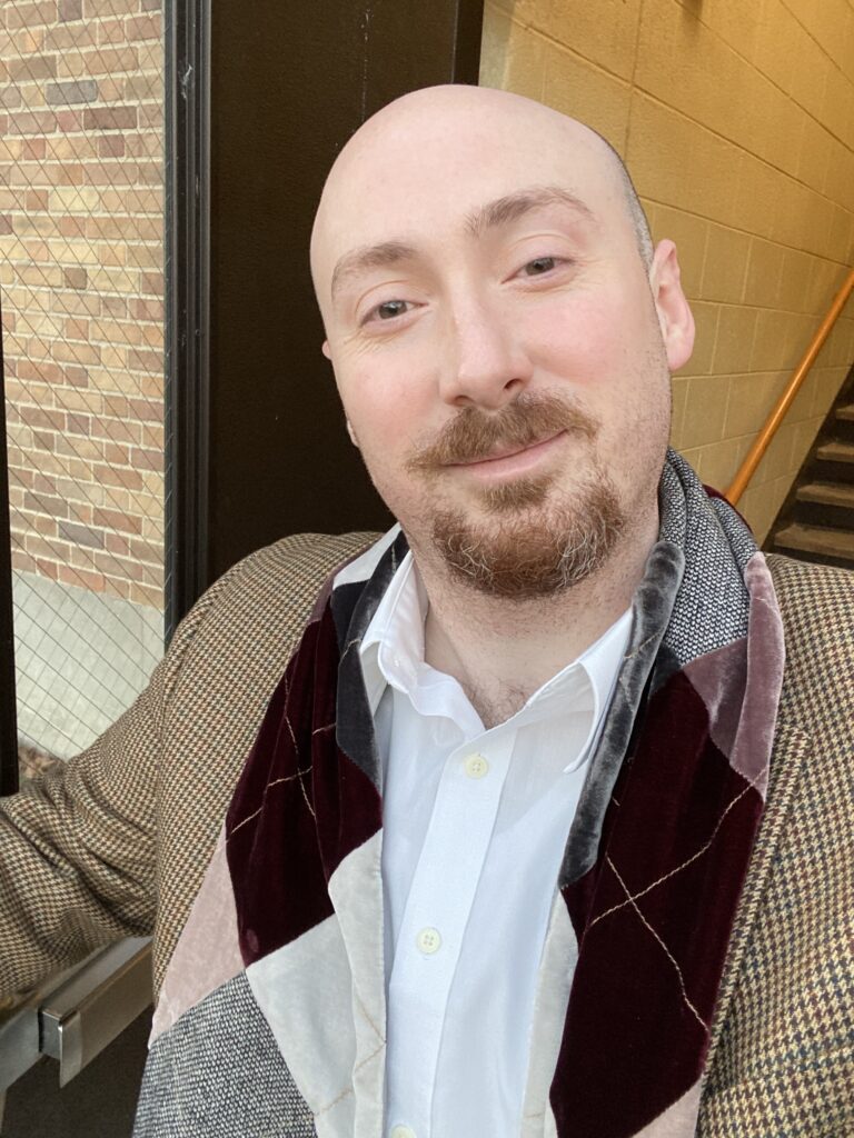 Portrait of a man outside Stephanie's Musique