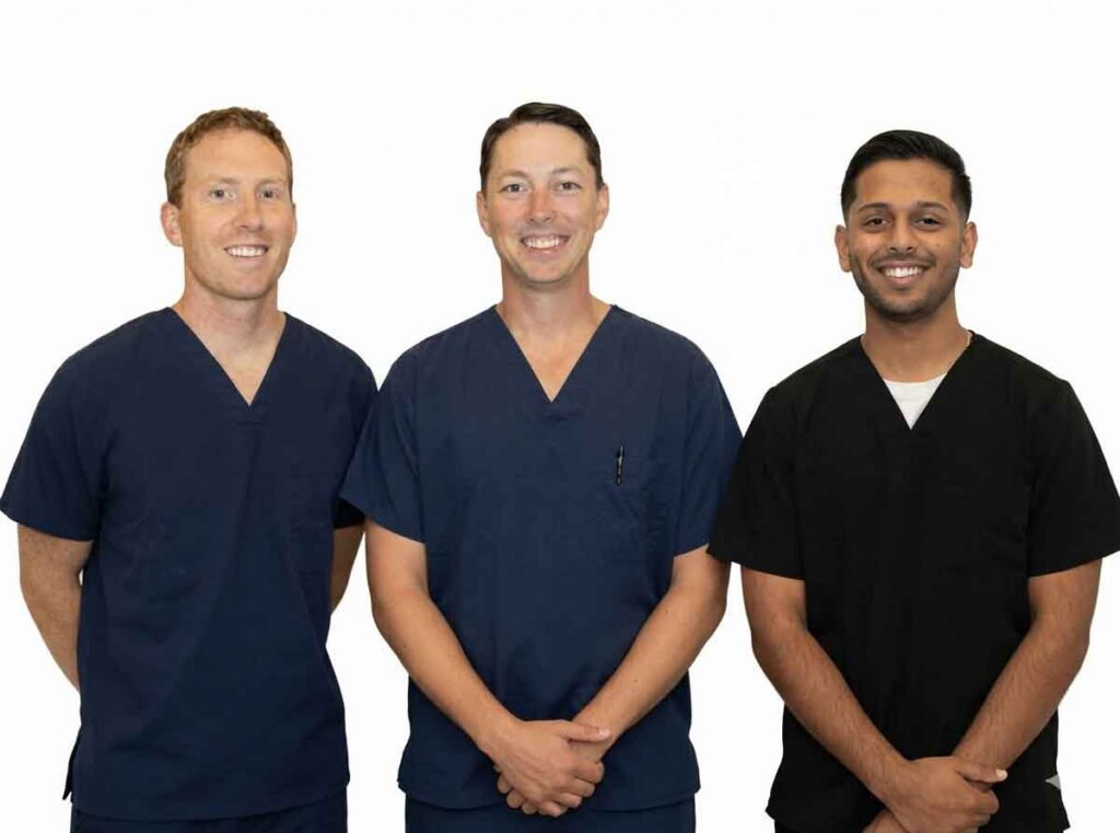 Deakyne Dental Associates PA team in dental scrubs