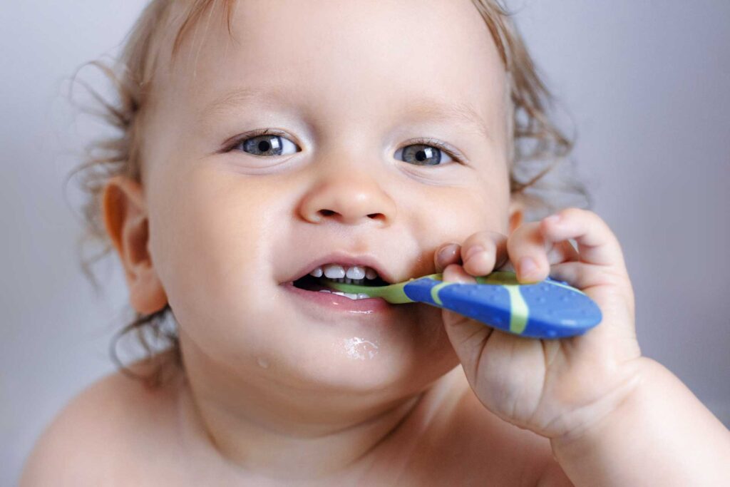 baby brushing teeth
