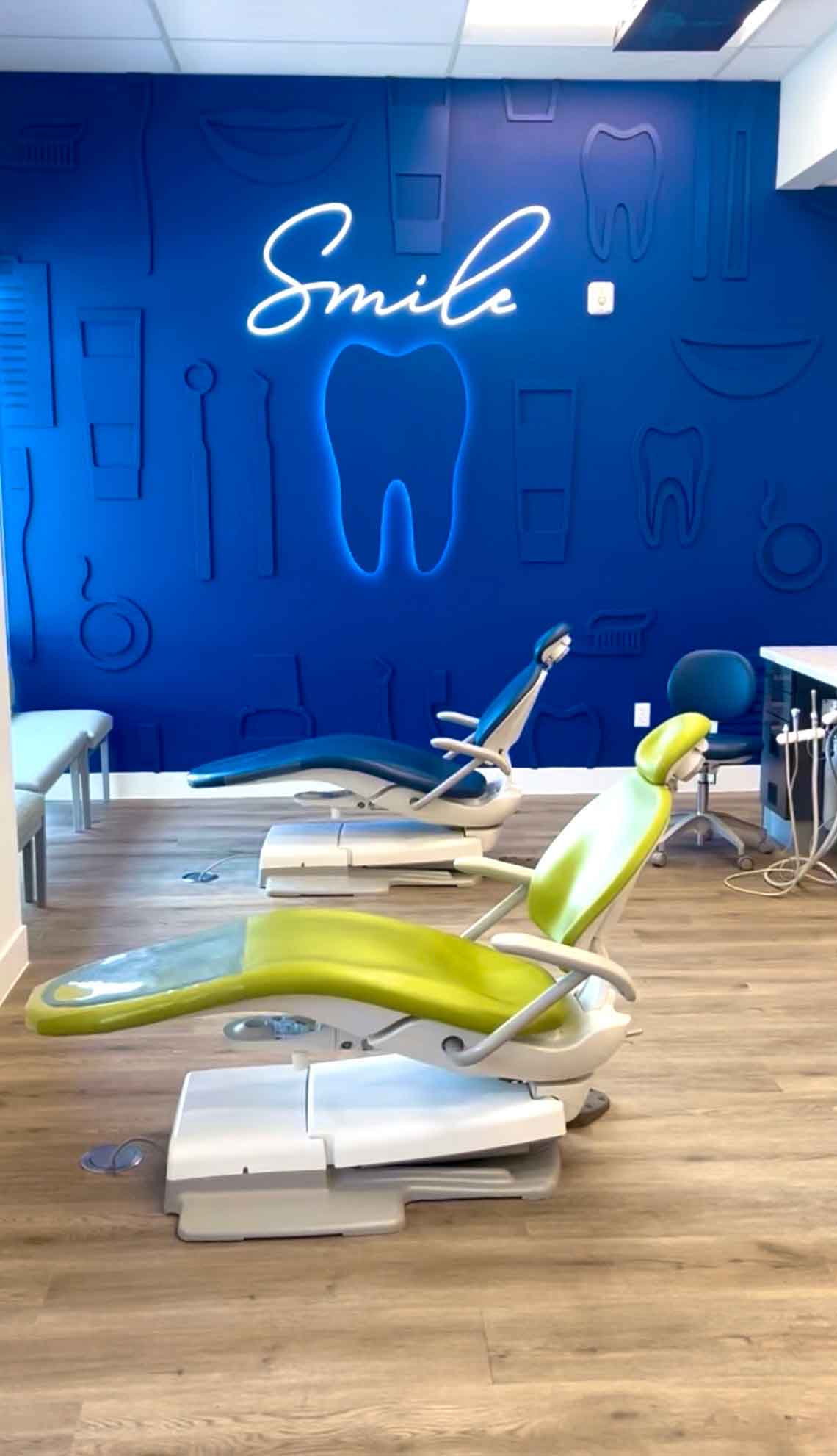 Johnson Pediatric Dentistry pediatric dental clinic room with child-friendly dental chairs and signage