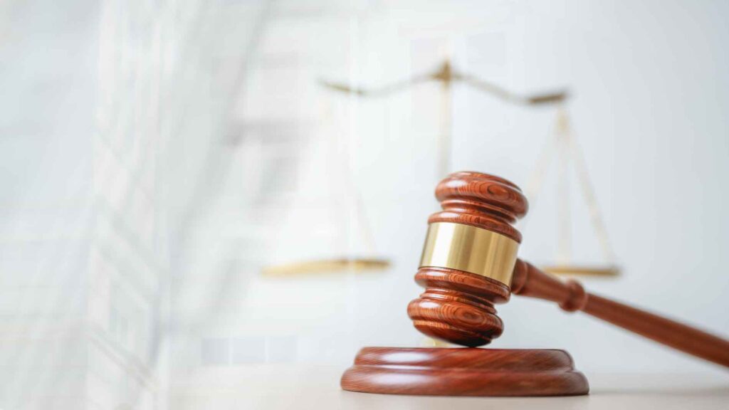 Law photo of gavel on scales of justice background