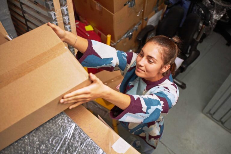 self storage shelf, woman holding a box