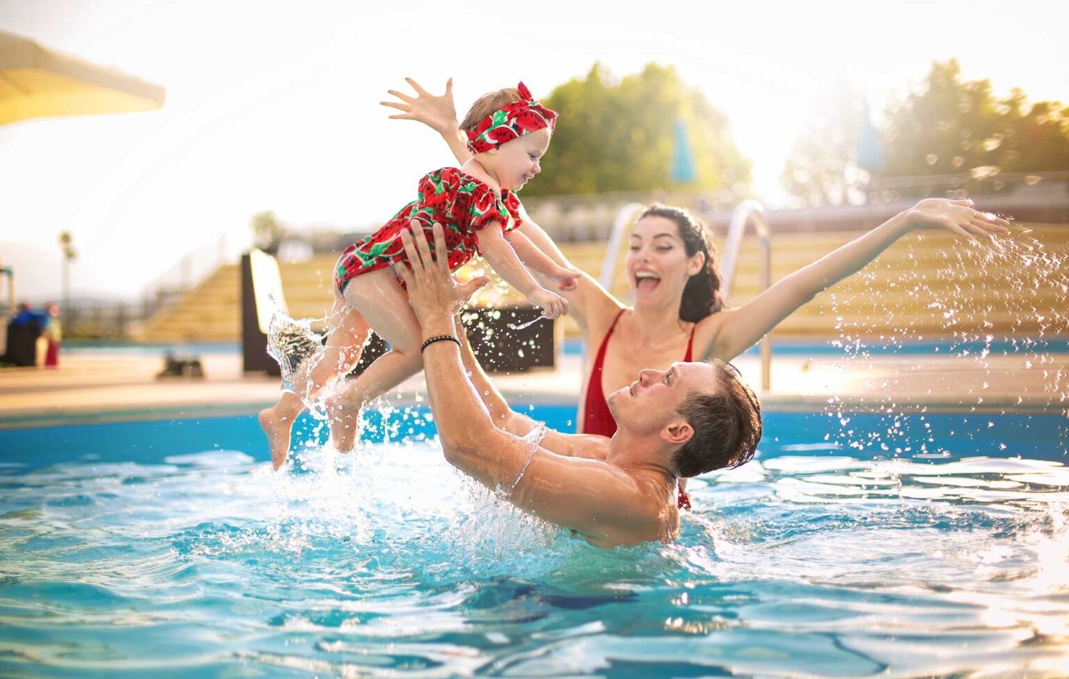 Holiday, portrait or happy family swimming in pool for bonding