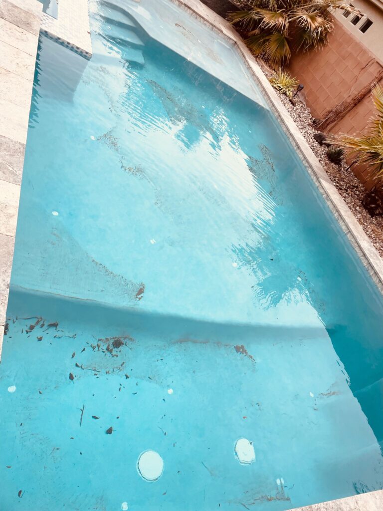 before cleaning, dirty swimming pool
