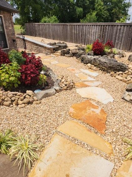 Stone pathway and flower beds