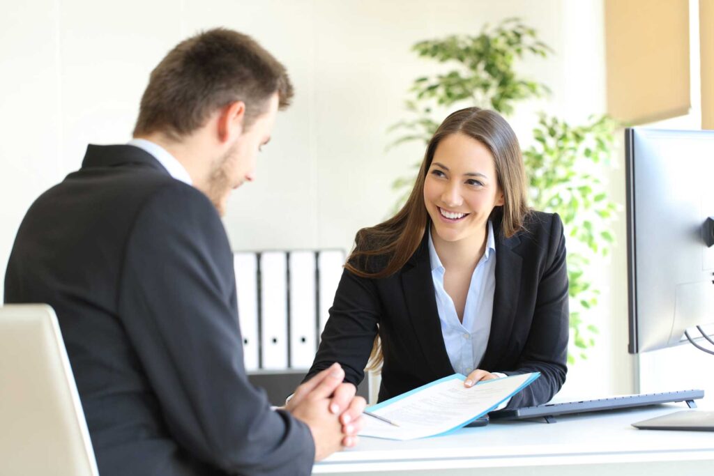 Cole Insurance Agency LLC agent meeting with client in office
