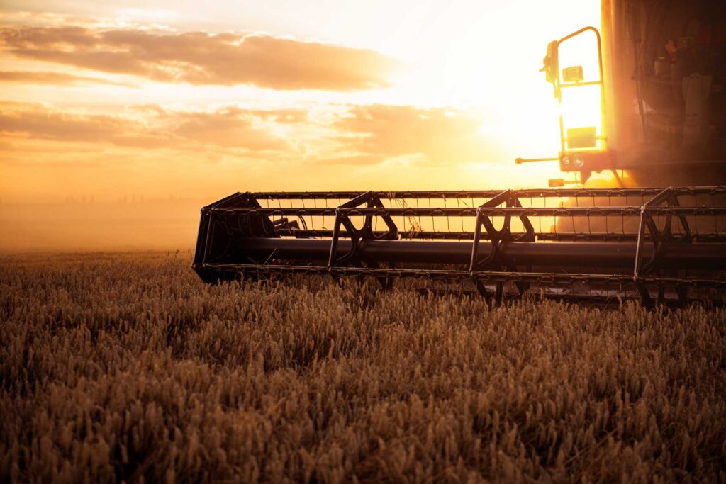 Cole Insurance Agency LLC providing insurance for farm equipment in a golden sunset wheat field