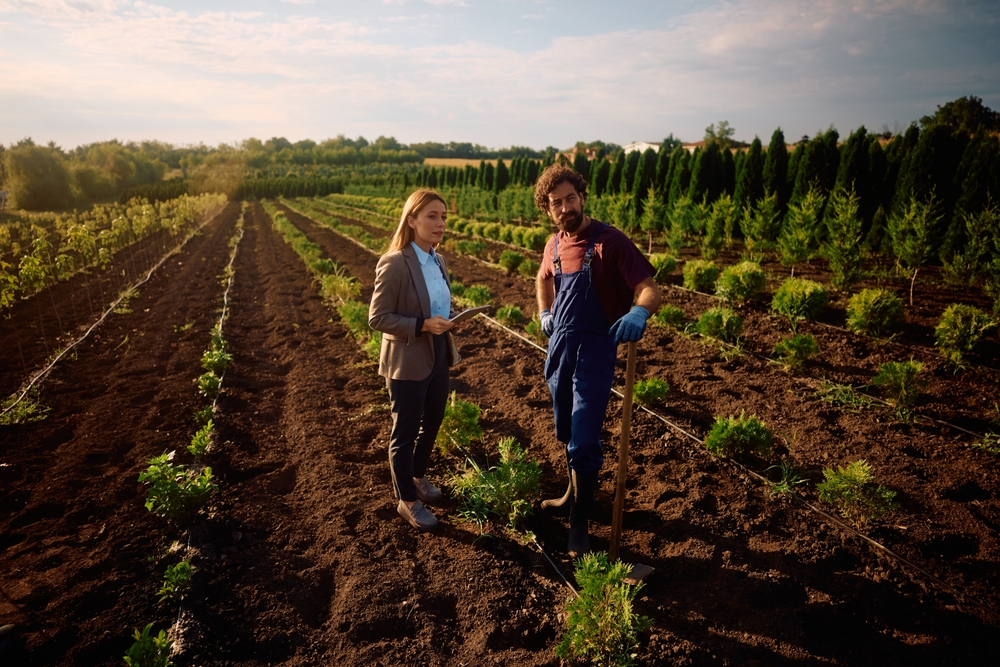Cole Insurance Agency, LLC team walking through a vineyard field at sunset