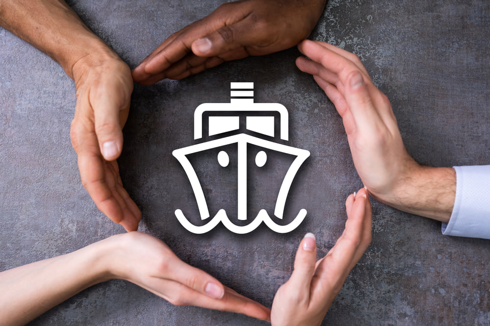 Hands forming a protective shape around an insurance icon representing Cole Insurance Agency LLC