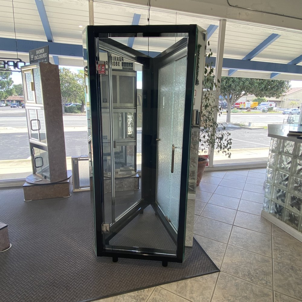 Mid Coast Glass showroom photo of a black glass door and entry display