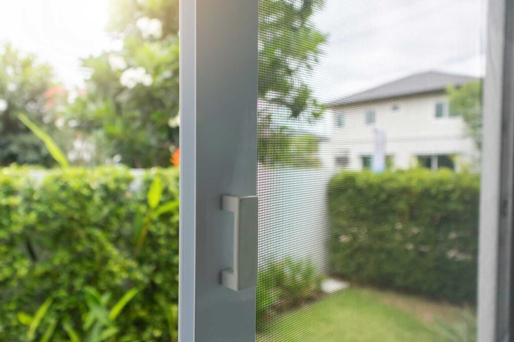 Mid Coast Glass screen door or window screen with garden view