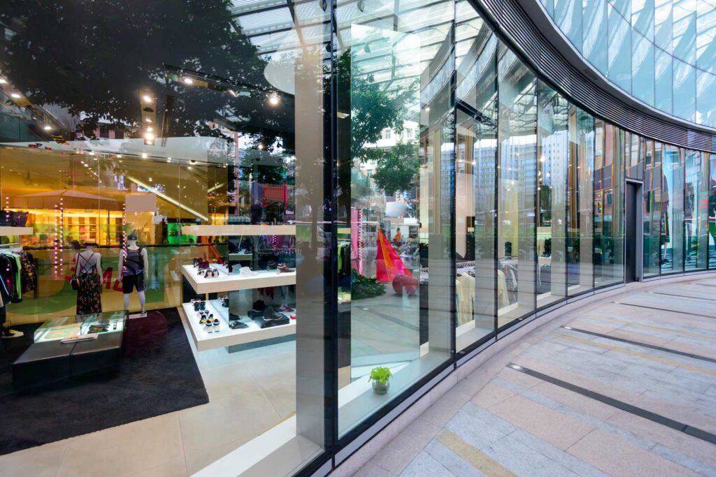 Mid Coast Glass storefront window installation with large glass panels and reflective storefront display