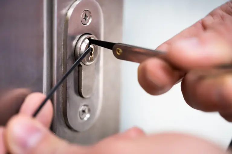 The KeyMaker locksmith using a key in a door lock