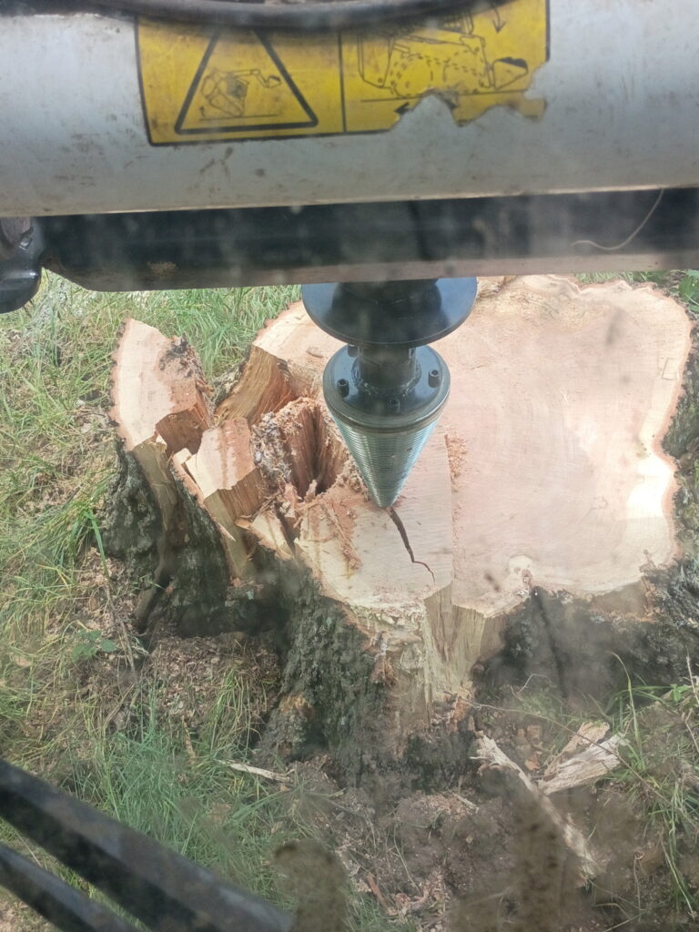 Southwest Missouri Tree Service stump grinding with heavy equipment and exposed tree stump