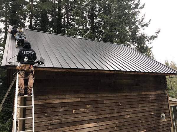 Undercover Roofing team member inspecting roof