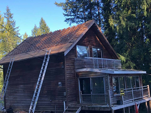 Undercover Roofing team member inspecting a roof