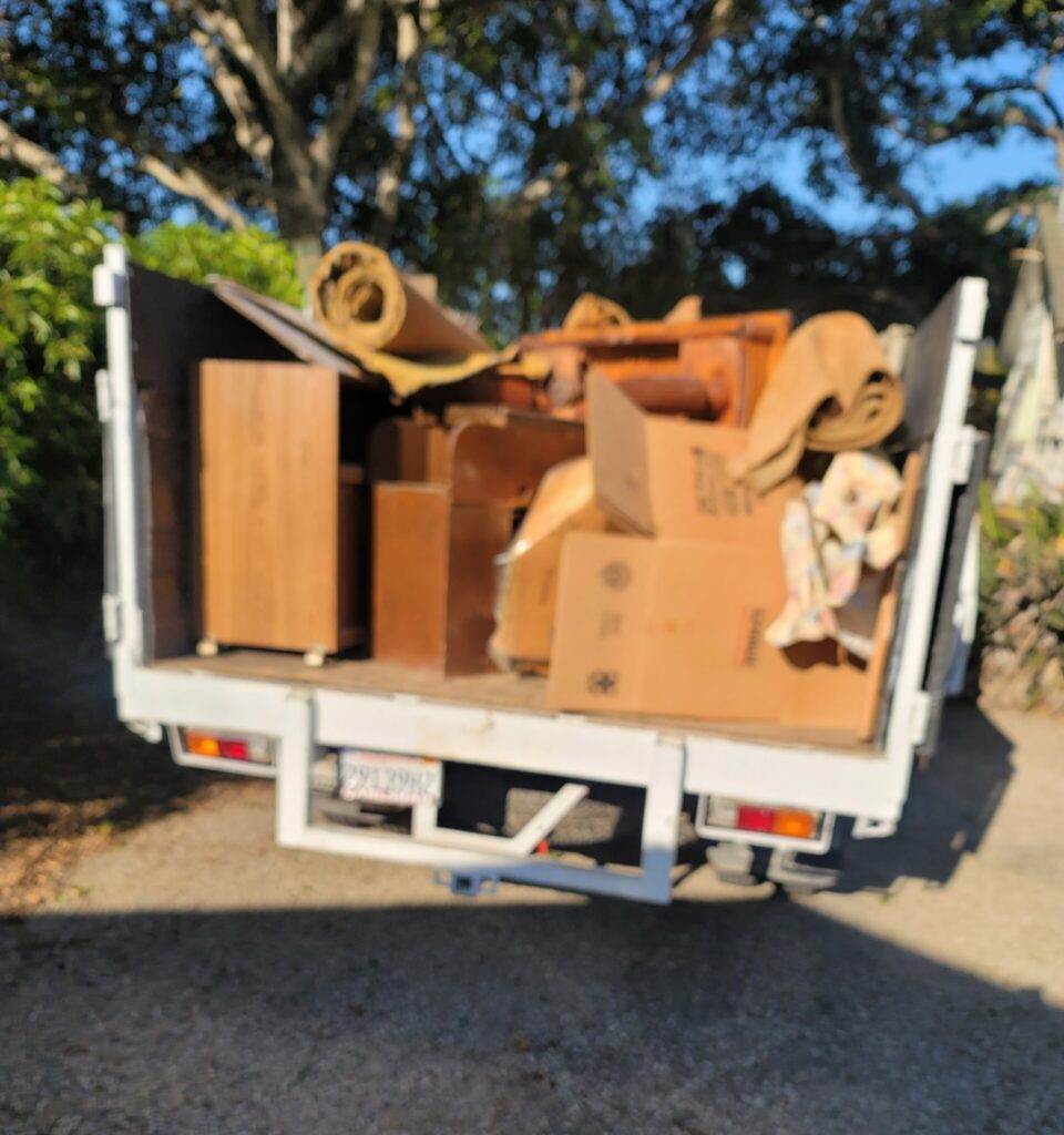 Casa Landscape Maintenance truck hauling landscaping debris and equipment
