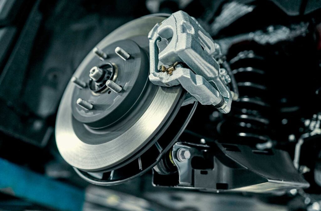 Close-up of a vehicle’s brake disc and caliper assembly