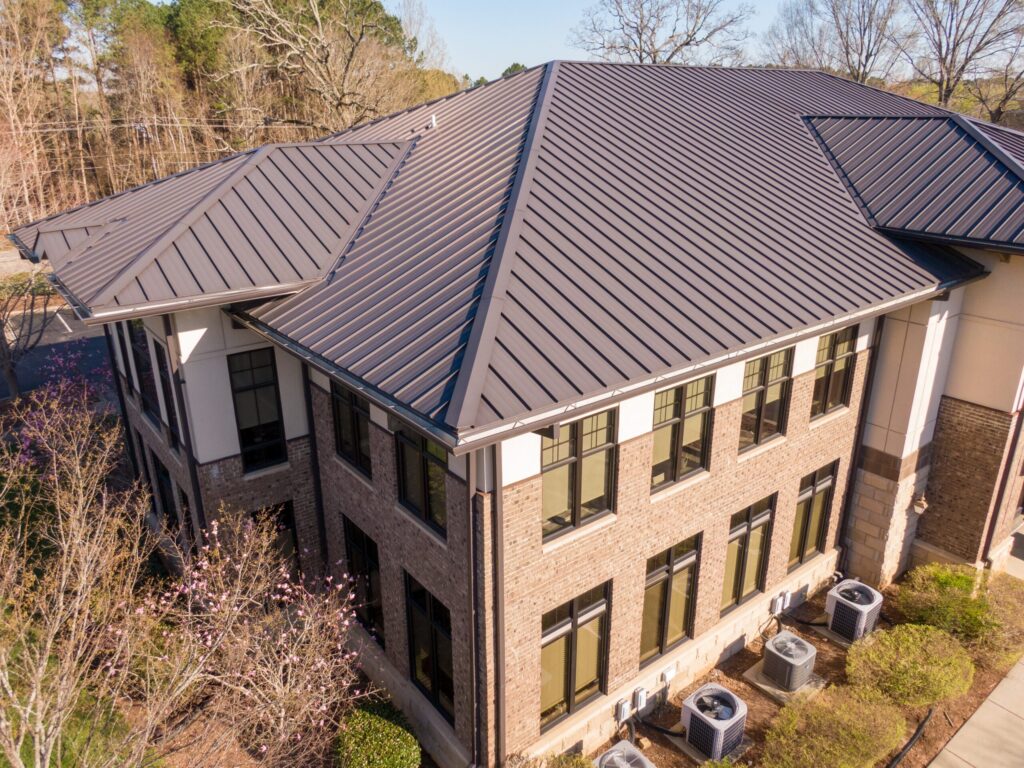 Aerial view of a metal roof installed on a commercial building