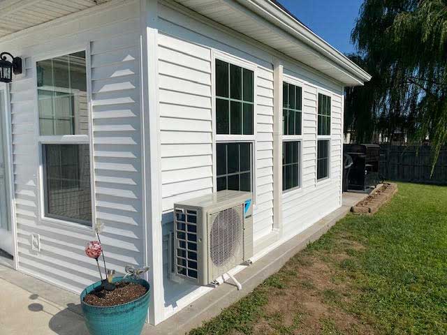 outside-unit-off-the-ground-on-siding-home