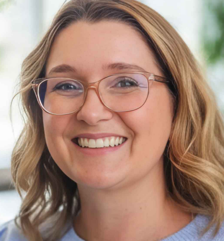Smiling woman wearing glasses, representing Journey Mental Health