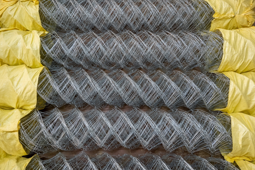 Coils of galvanized wire mesh wrapped for delivery from Jim's Lumber