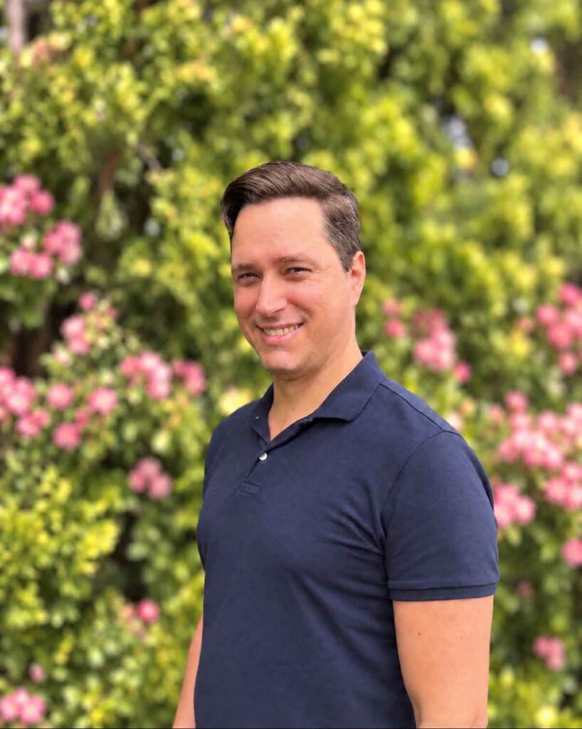 Smiling Boise Valley Chiropractic team member outdoors in a garden