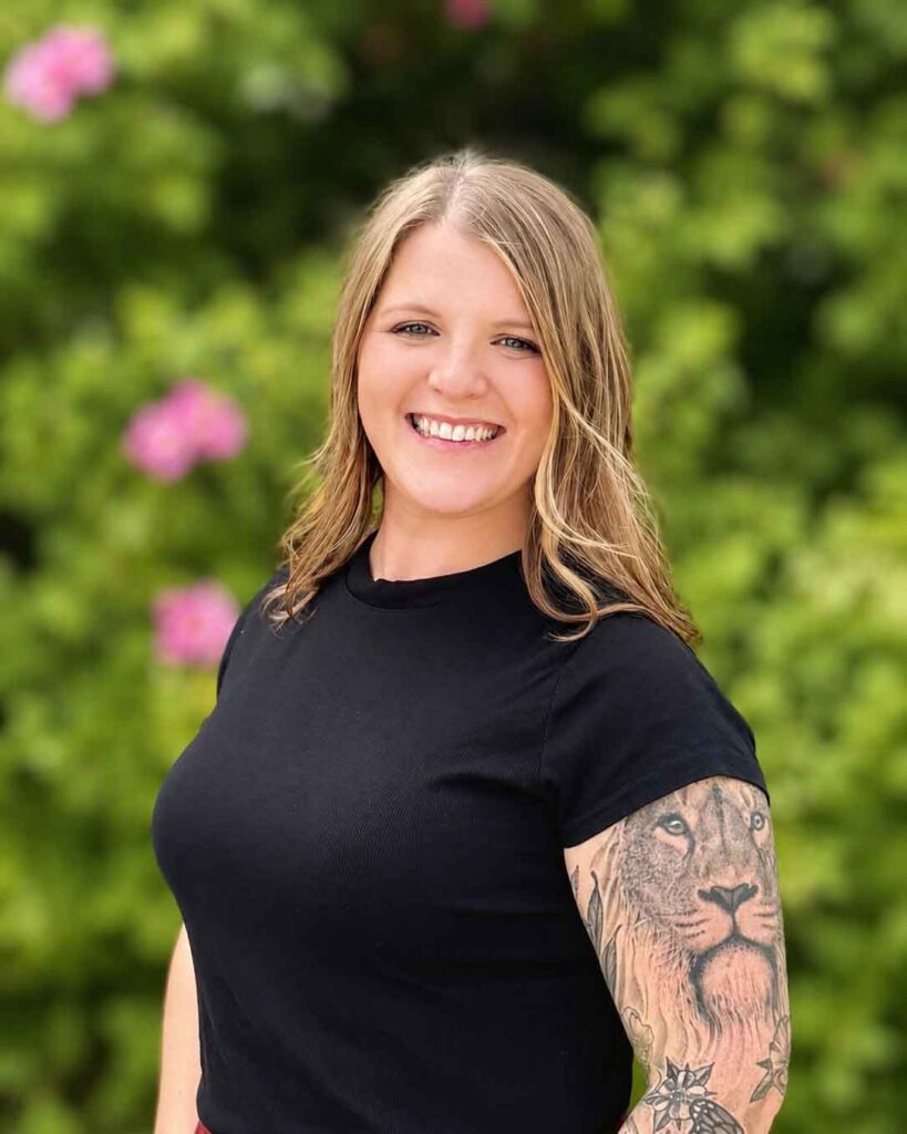 Smiling female chiropractor in outdoor garden setting for Boise Valley Chiropractic