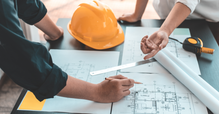 An architect and a building going over a house building plan