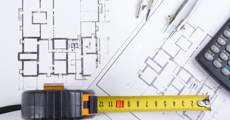 Permit plan Sets with a tape measure and a calculator